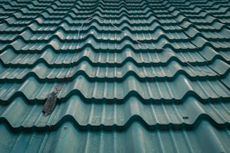 the roof of a building with a bird on it