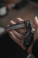 a person holding a knife in their hand