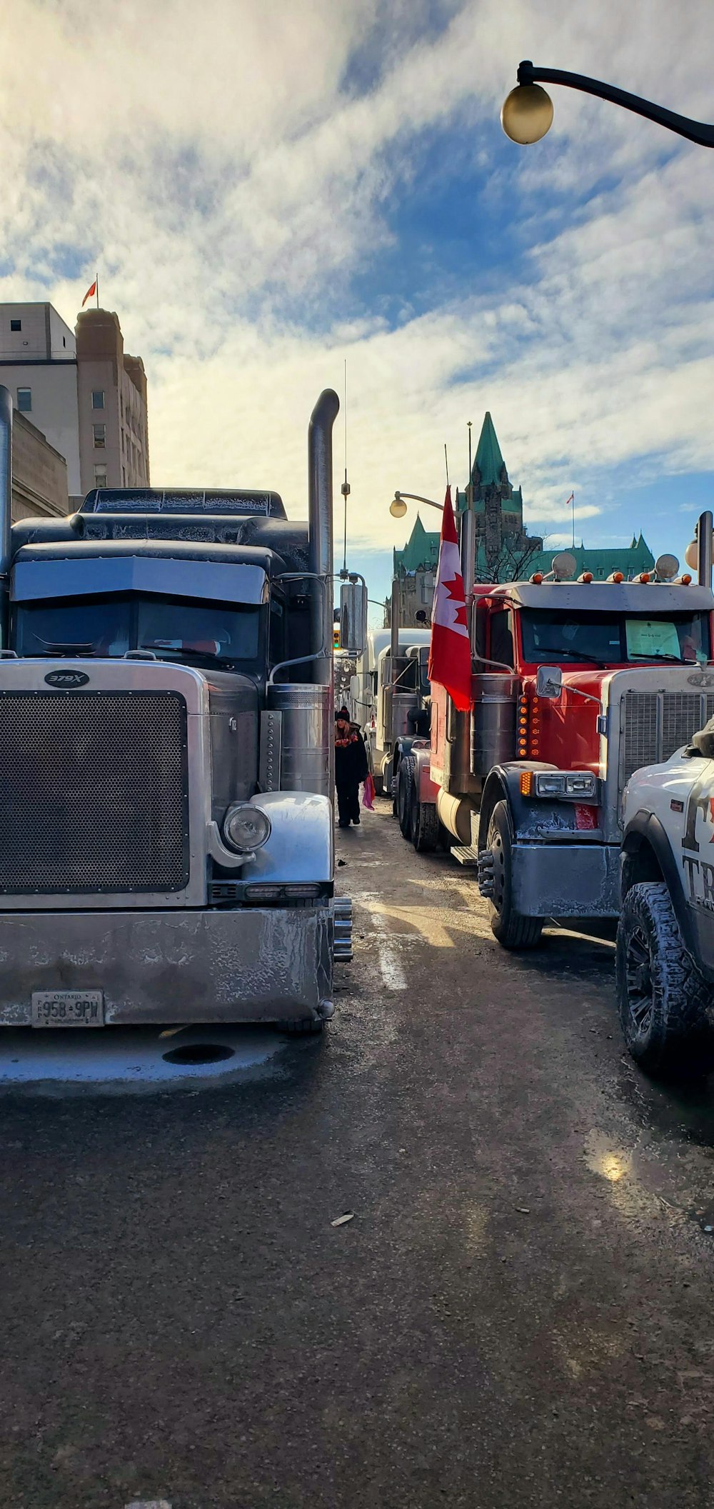 a group of trucks parked on the side of a road