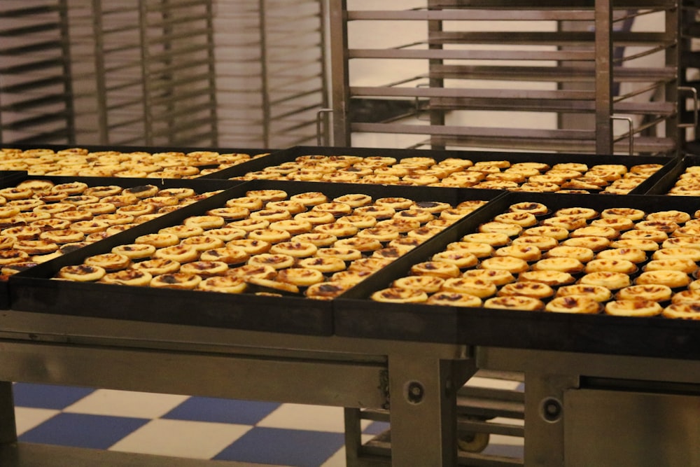 a conveyor belt filled with lots of pastries
