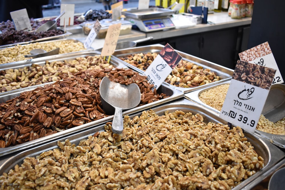 a variety of nuts are on display at a market