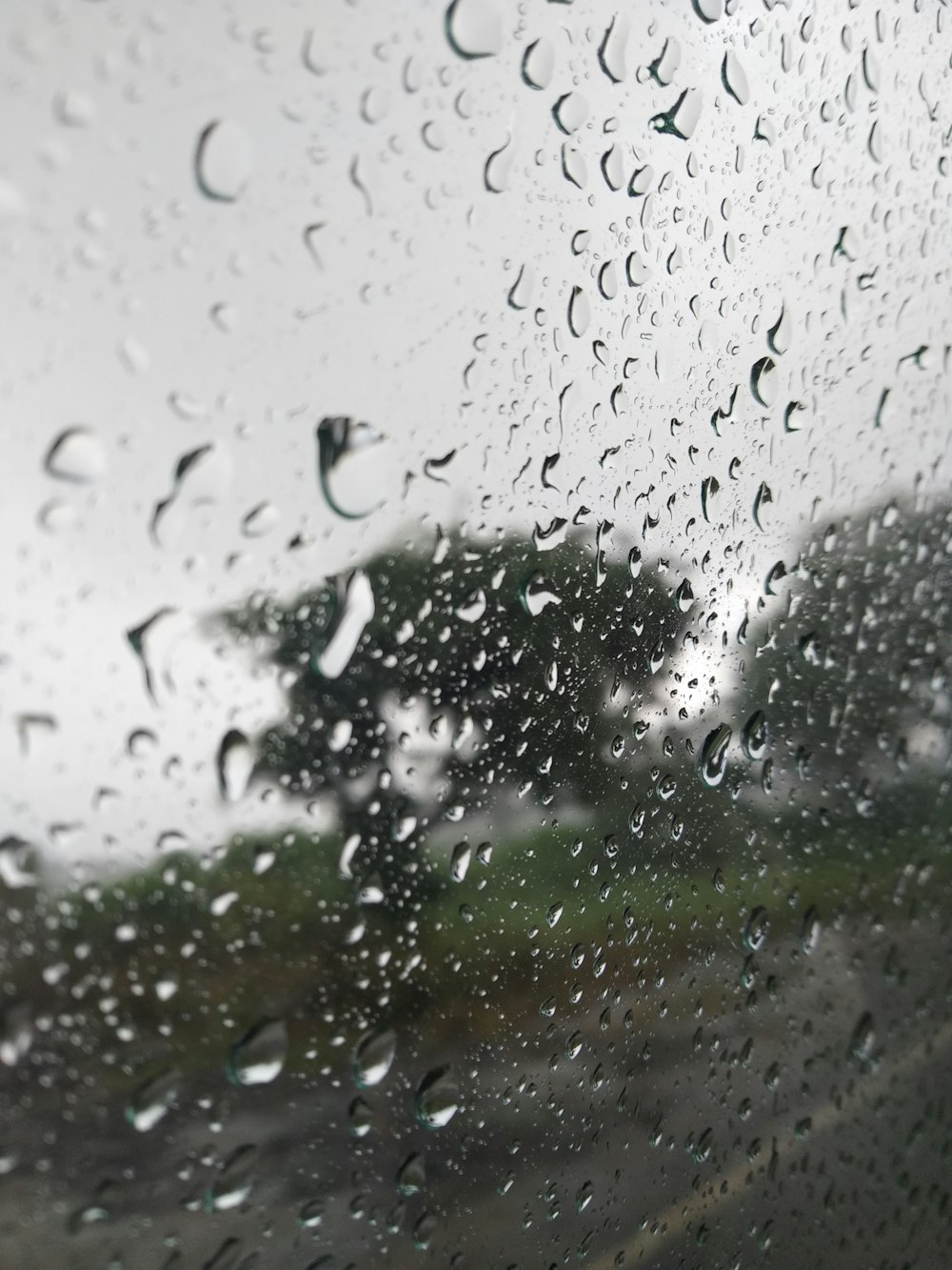 rain drops on the window of a car on a rainy day