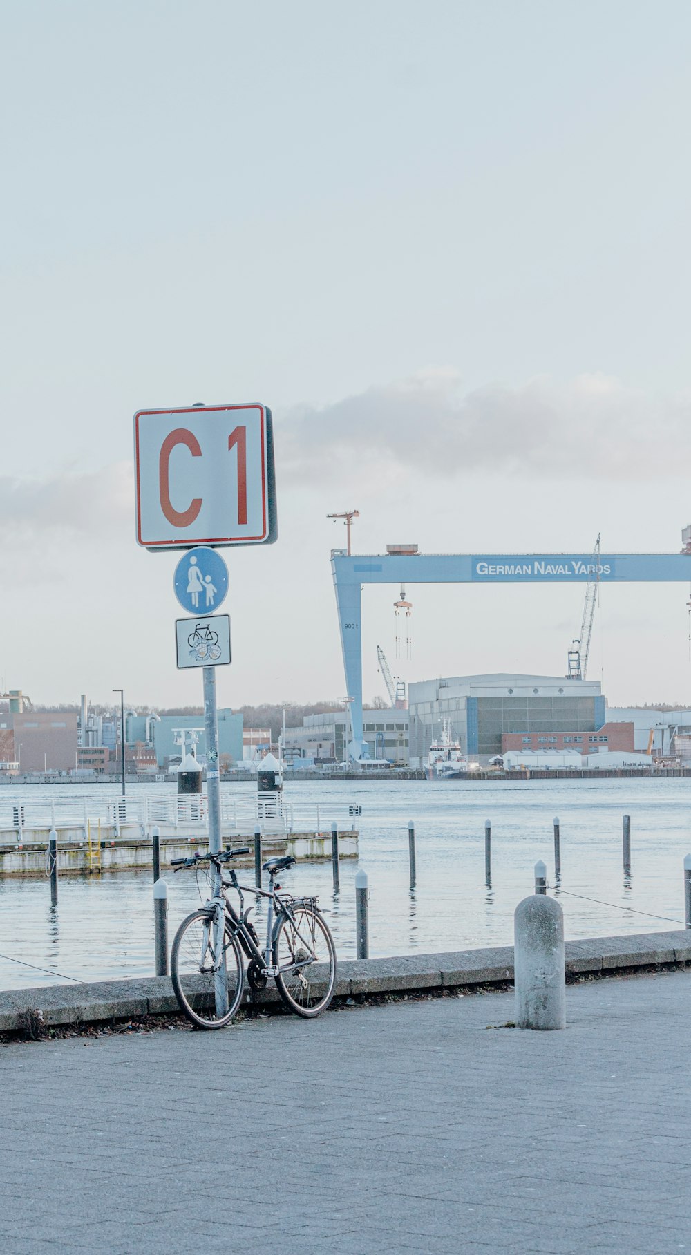 a bicycle is parked next to a street sign