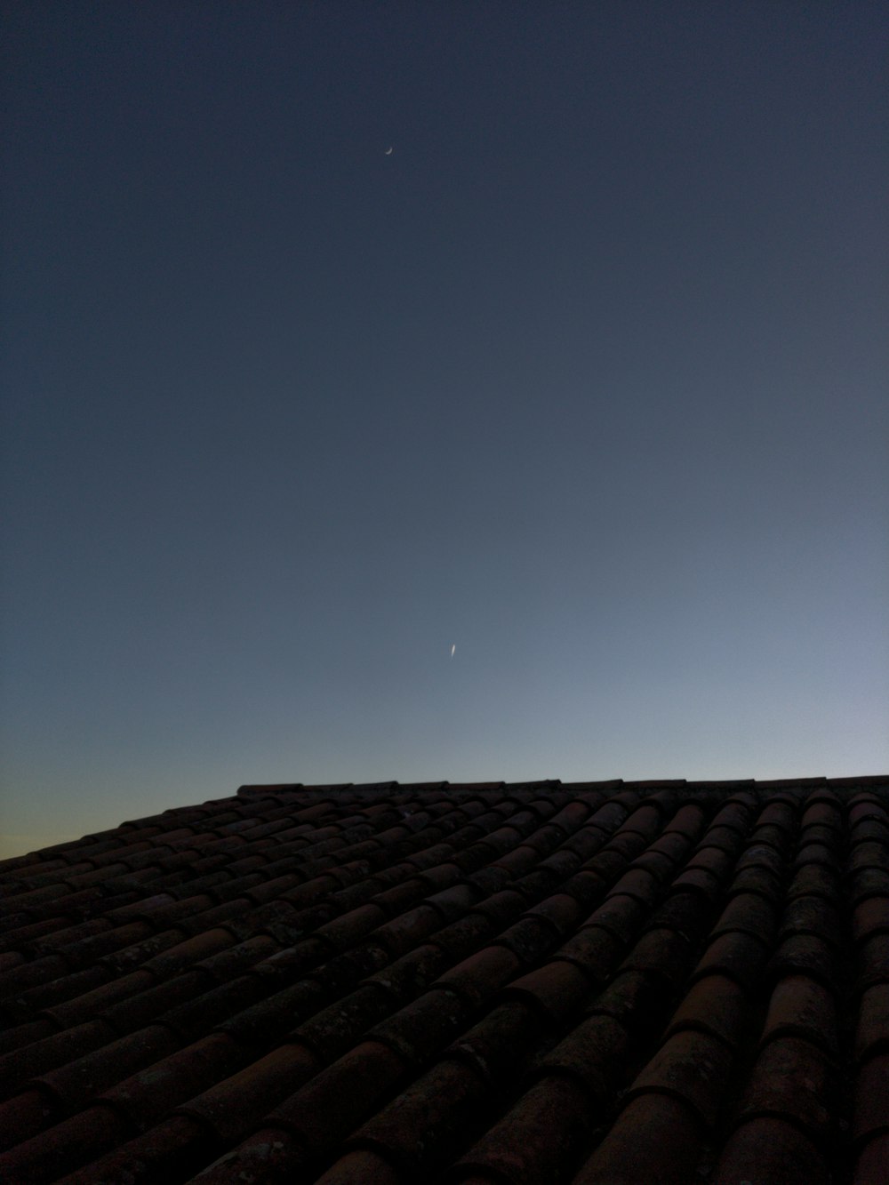 a view of the sky from the roof of a building