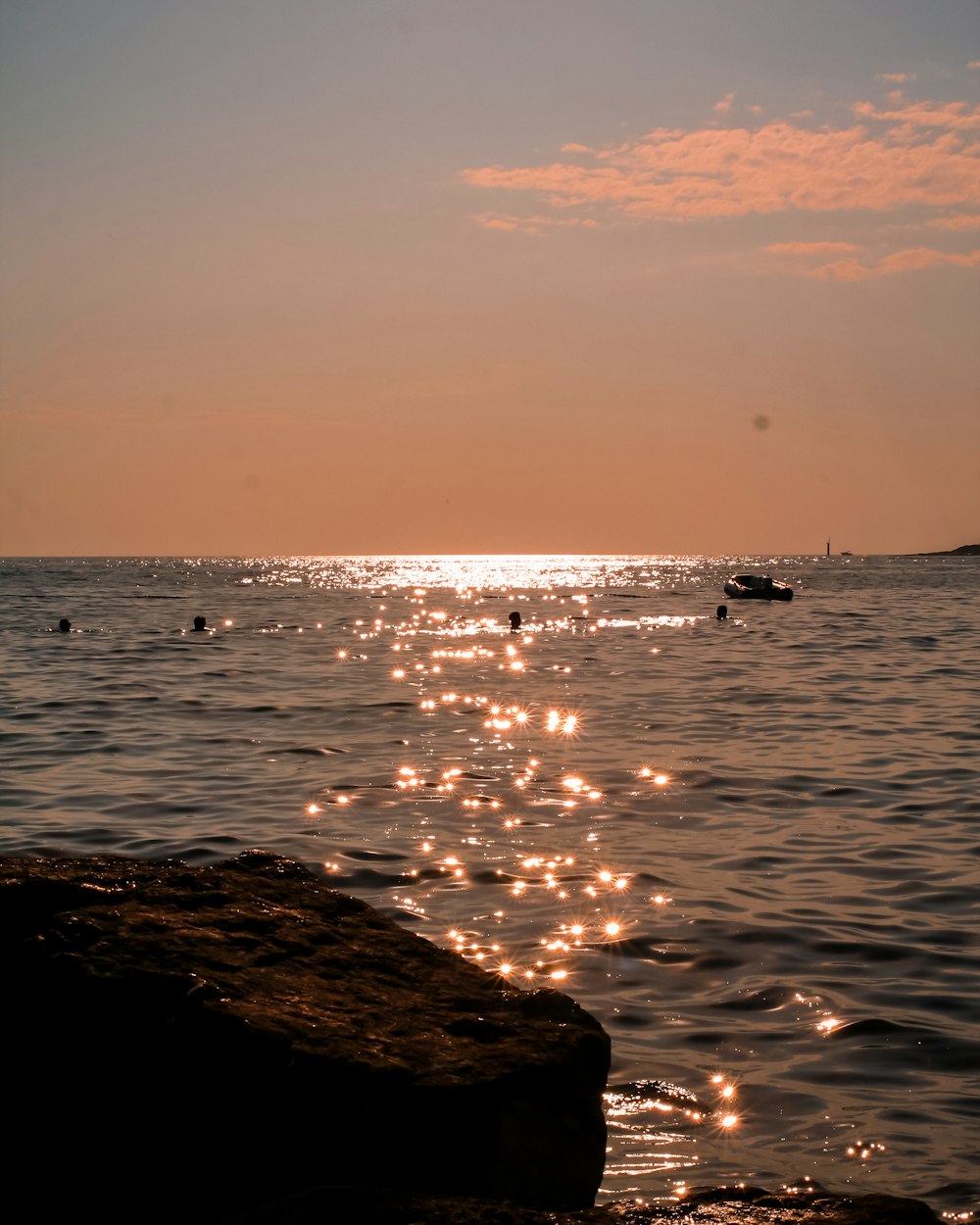 a body of water with a boat in the distance