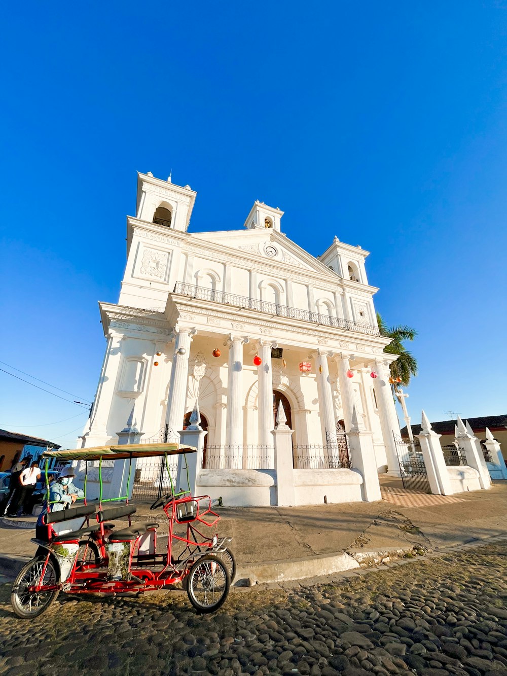 a motorcycle parked in front of a white building