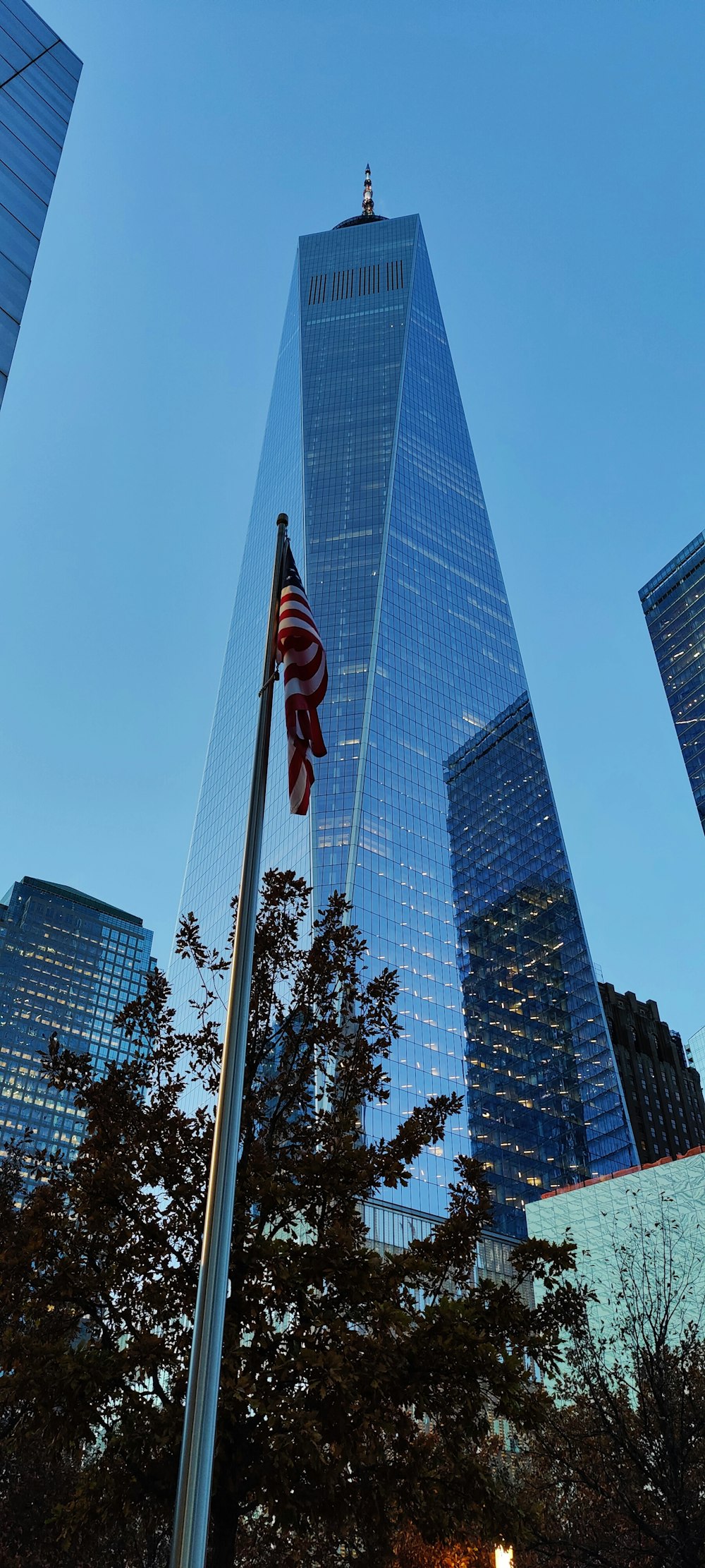 a tall building with a flag on top of it