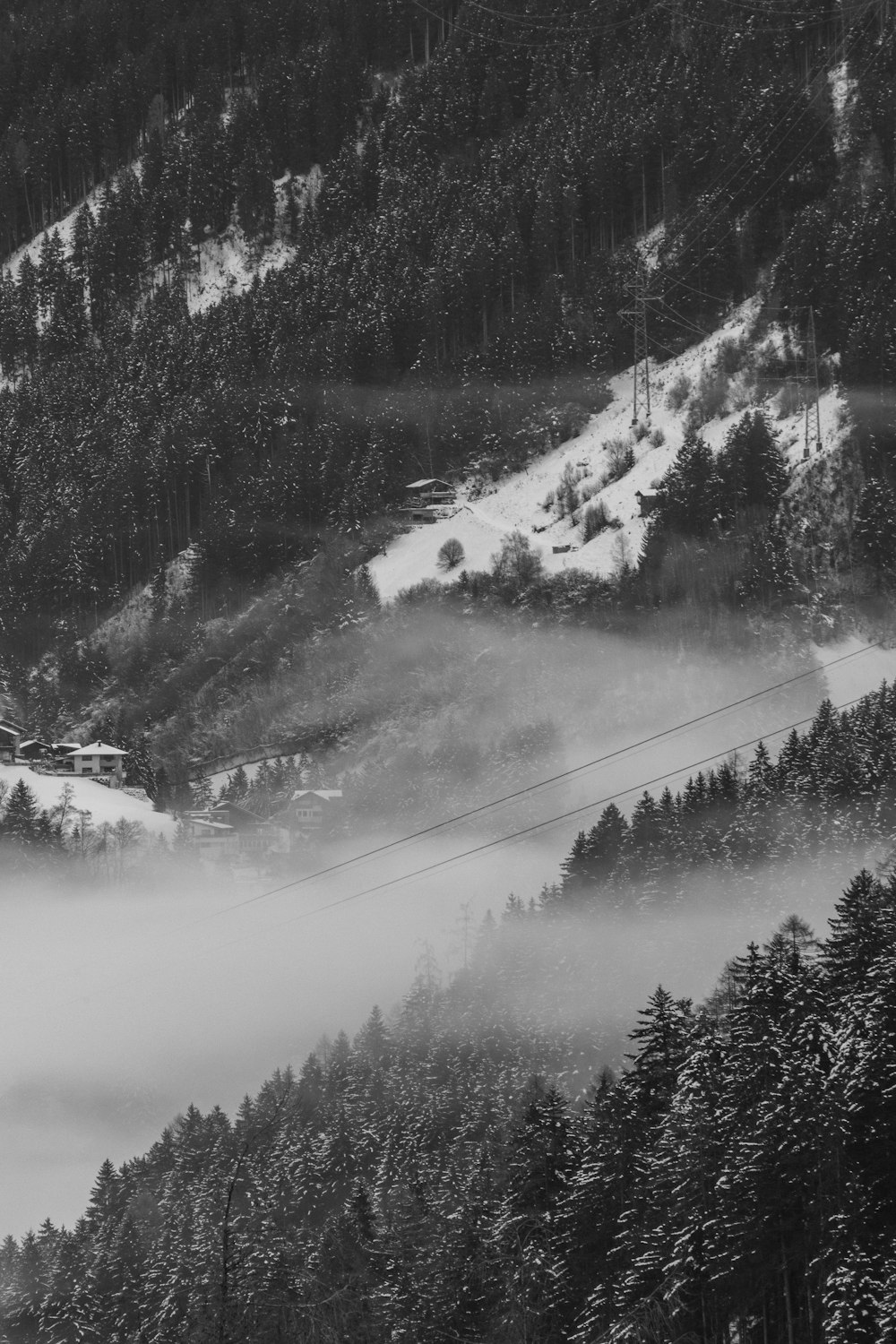 a black and white photo of a ski slope