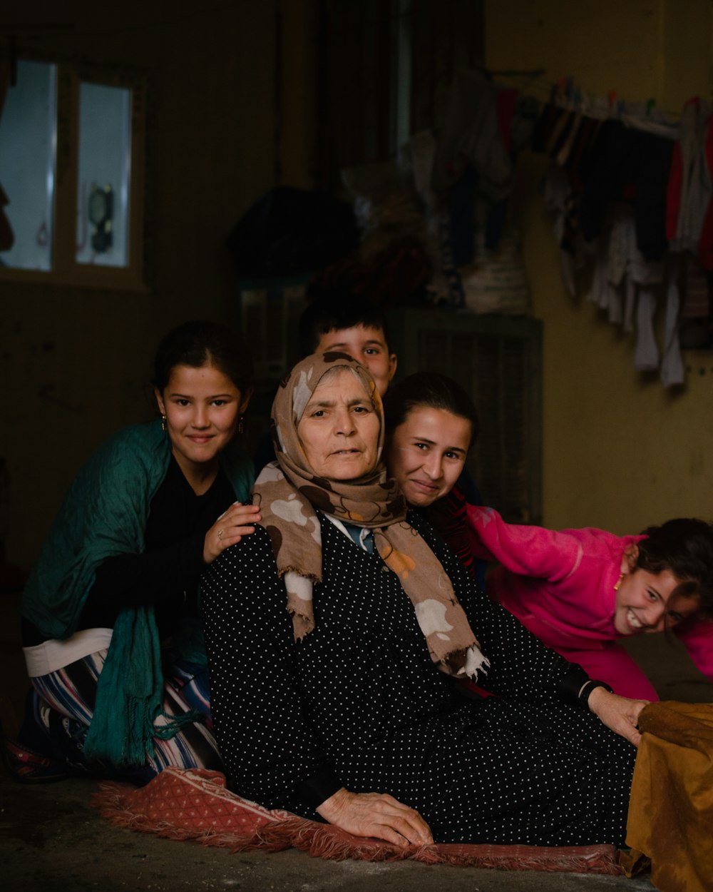 a group of people sitting around each other