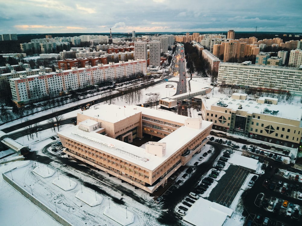 an aerial view of a large building in the middle of a city