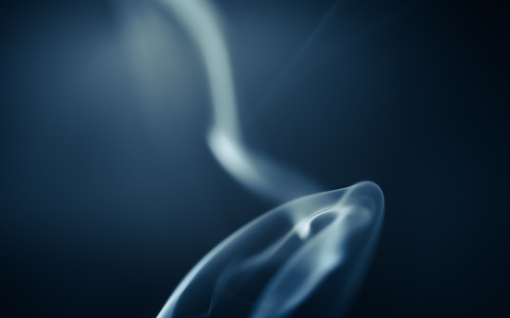 a blue smoke background with a black background
