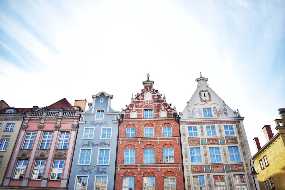 a row of buildings with a sky background