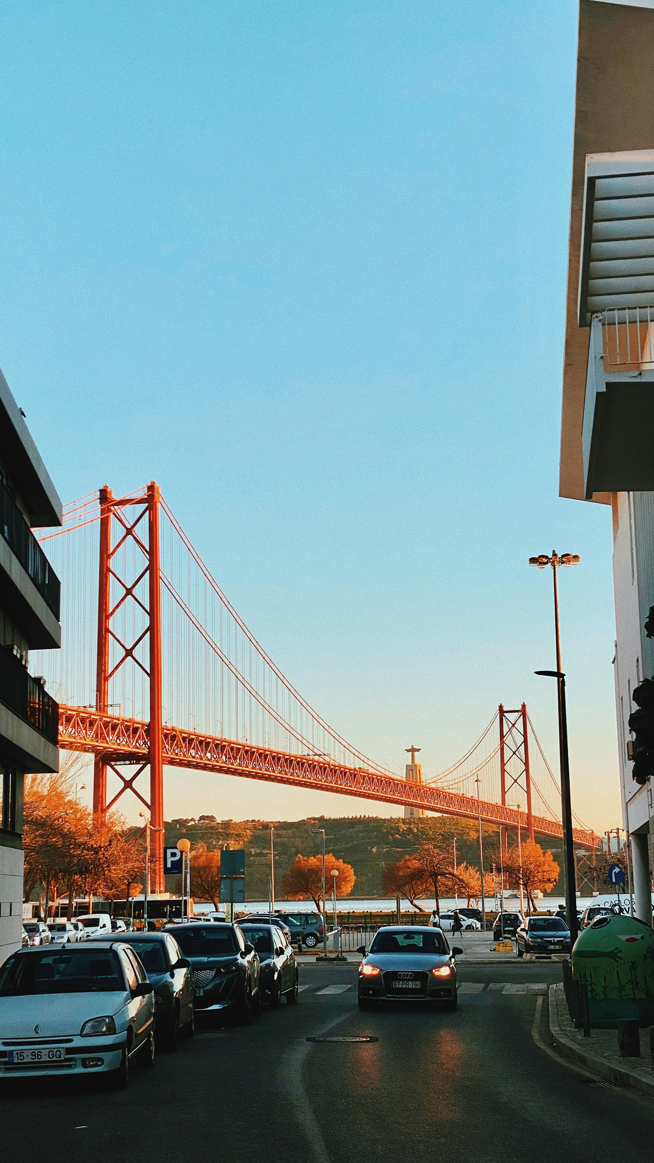 a view of the golden gate bridge from a parking lot