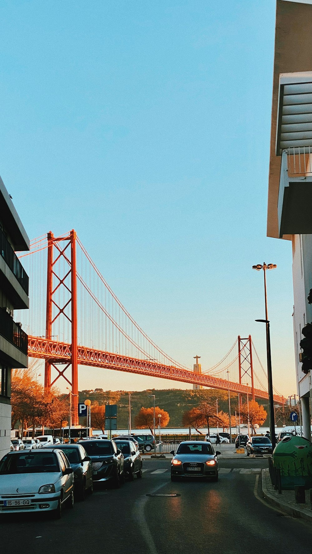 a view of the golden gate bridge from a parking lot