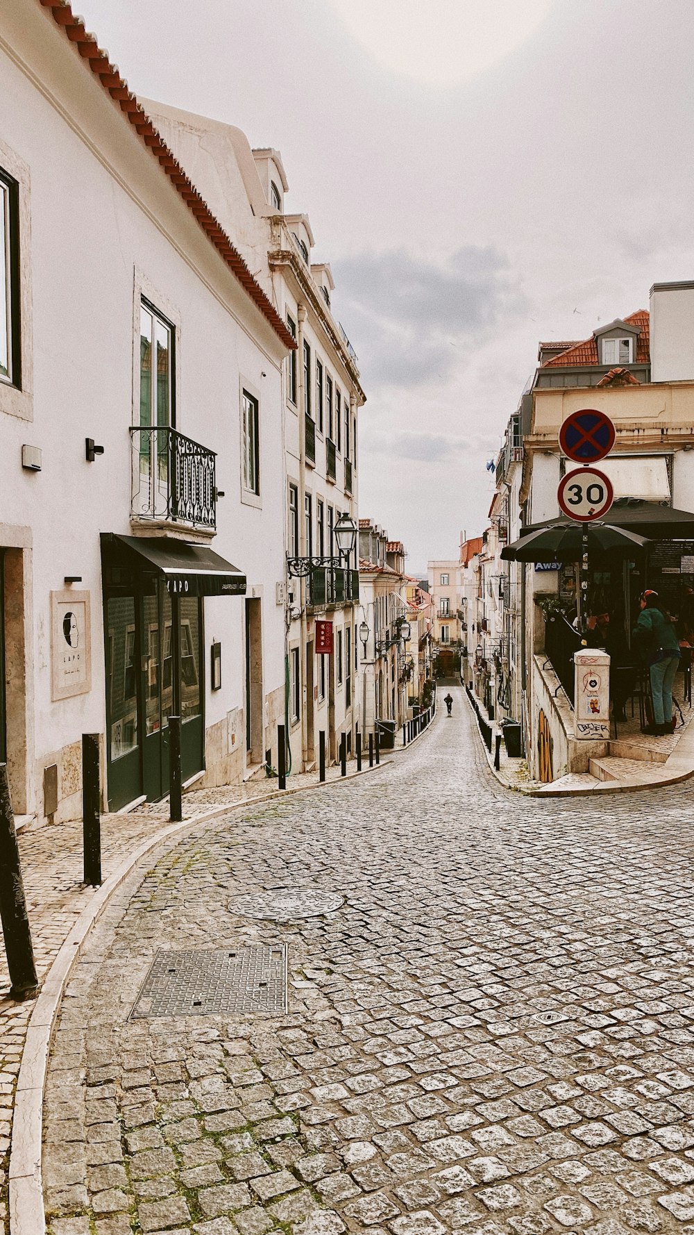 a cobblestone street in a european city