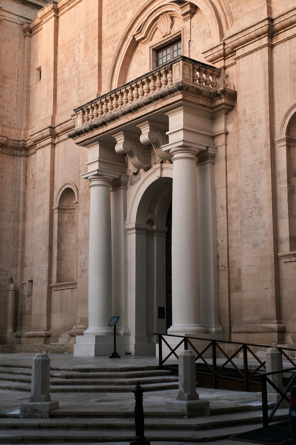 a large building with columns and a clock