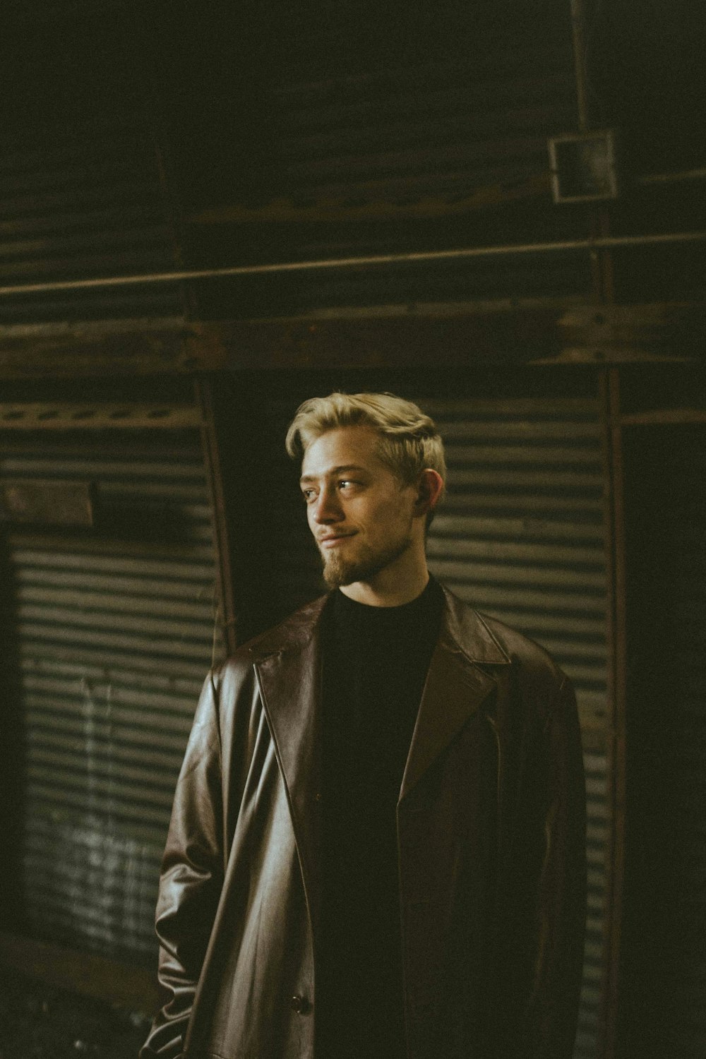 a man standing in front of a garage door