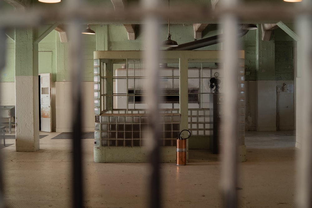 a jail cell with bars on the door