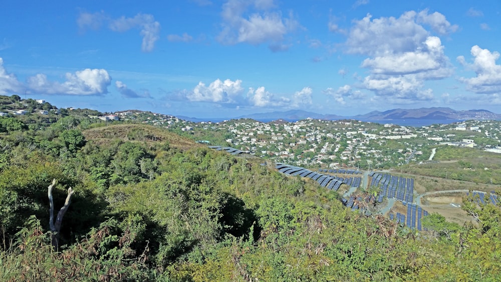 a scenic view of a city from a hill