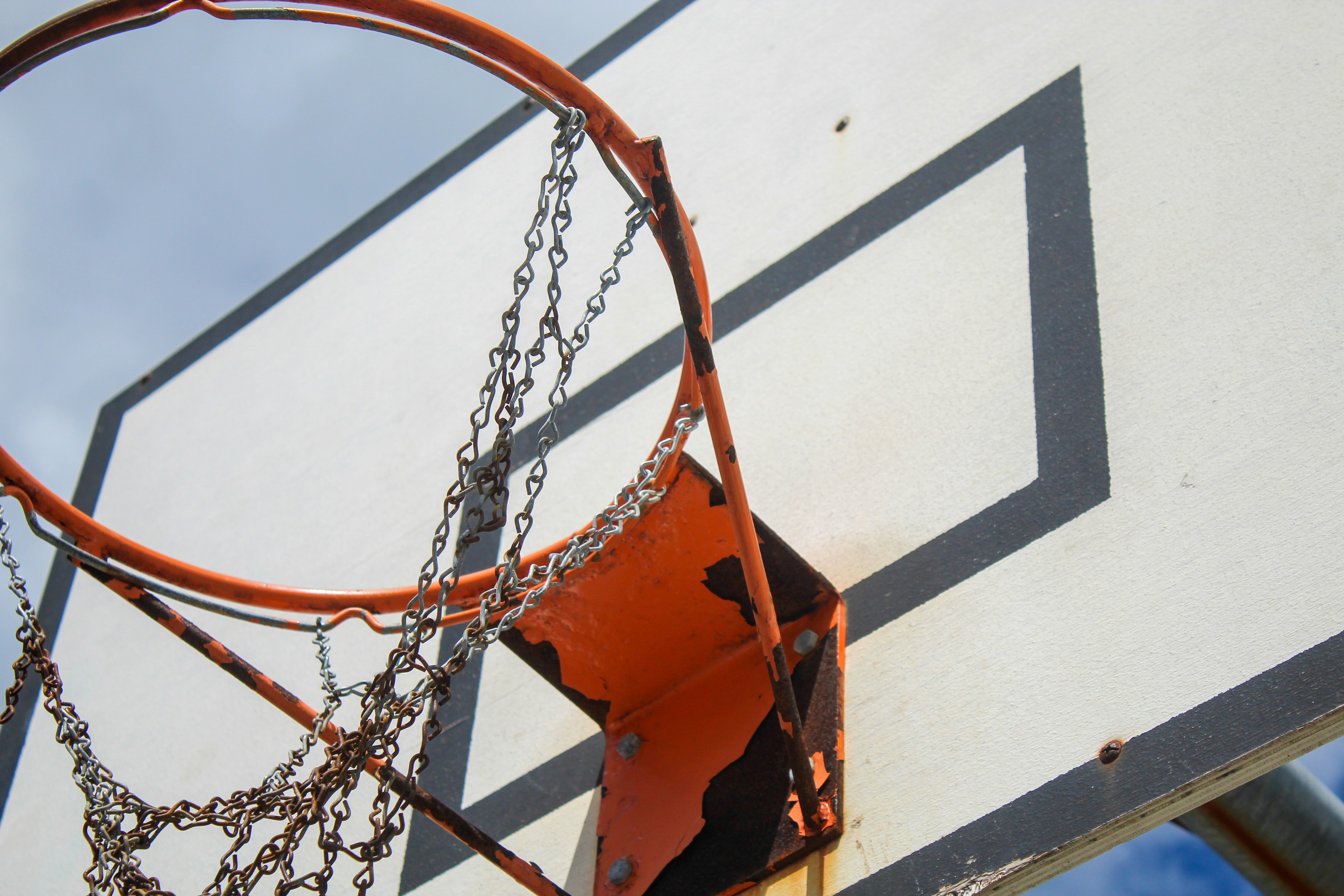 A close up of a basketball hoop with chains on it photo Free Hoop