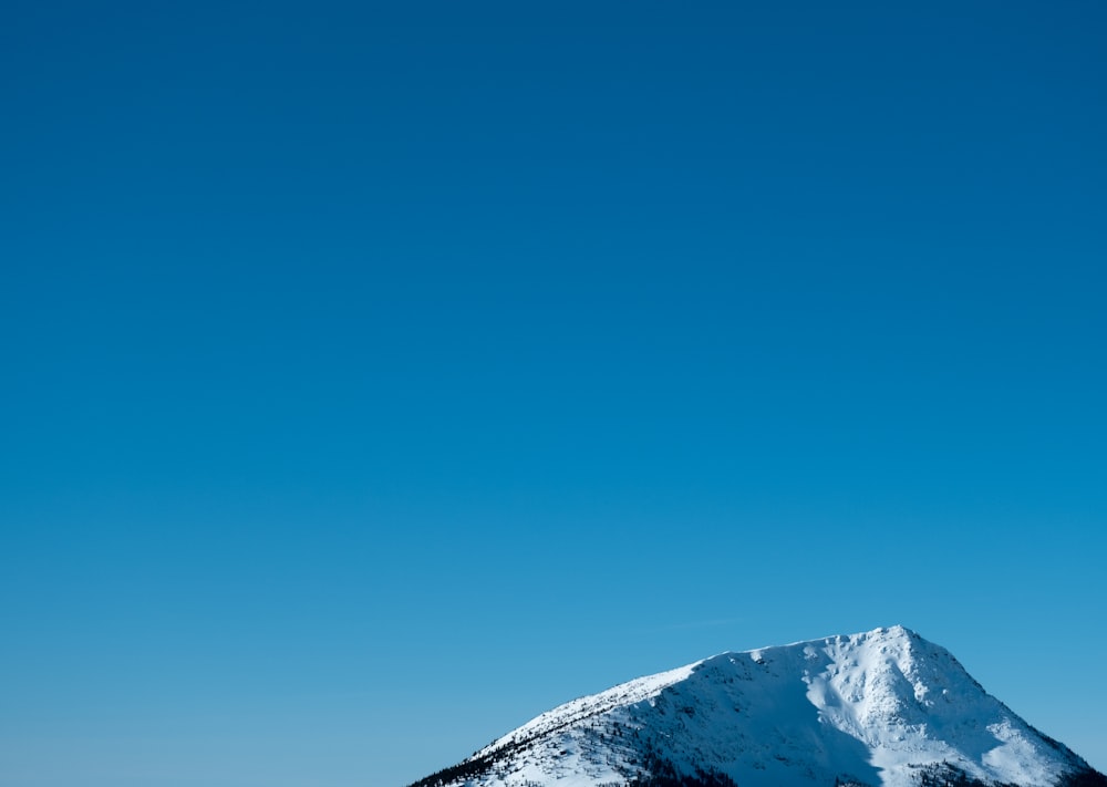 a snowboarder is doing a trick in the air