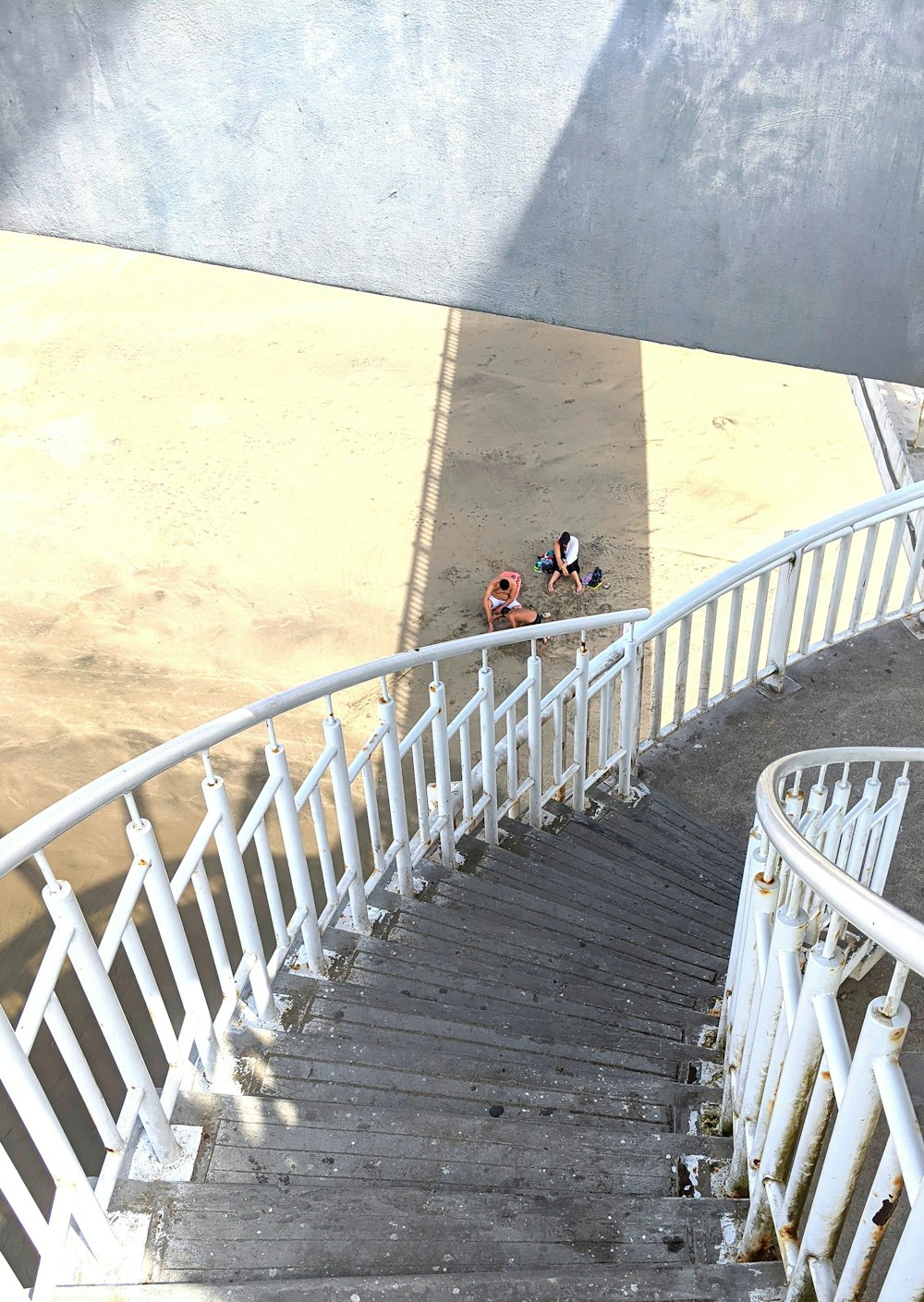 a man riding a skateboard down a set of stairs