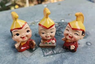 Close-up of a music box with a happy emotion figure on top.
