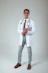 a male doctor in a white coat and tie