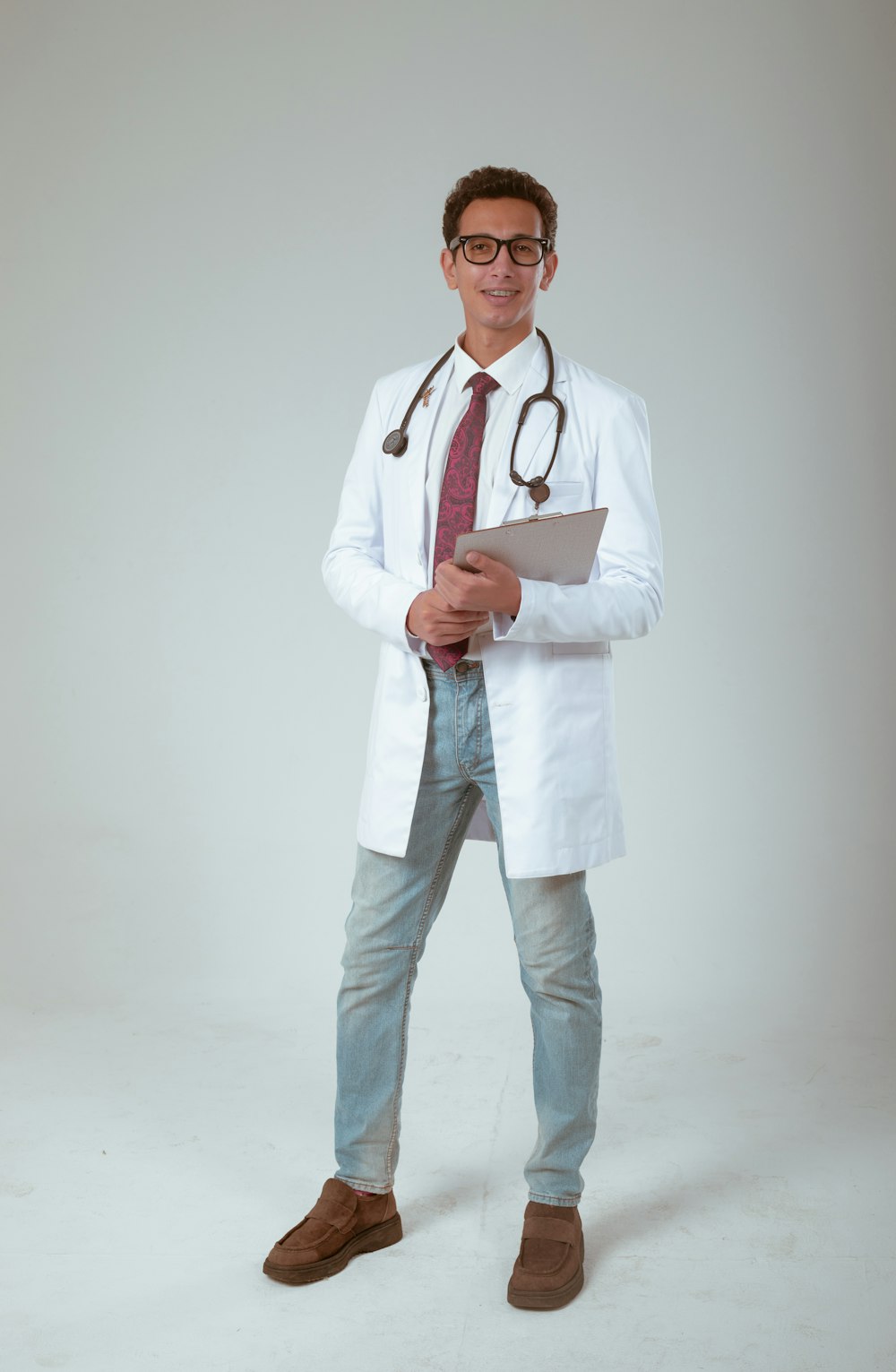 a male doctor in a white coat and tie