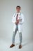 a male doctor in a white coat and tie