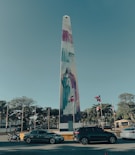 a tall monument with a painting on it