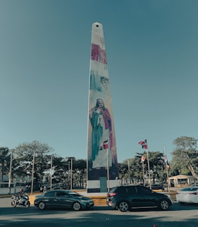 a tall monument with a painting on it