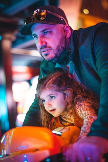 a man and a little girl on a motorcycle