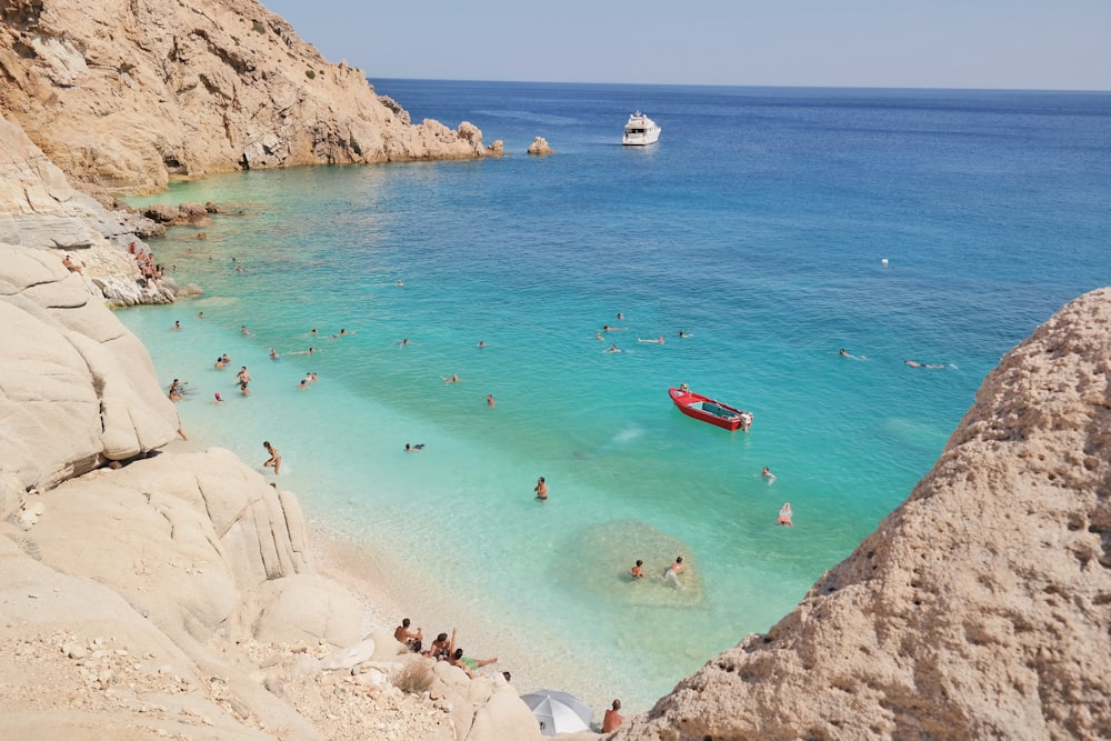 a group of people swimming in the ocean