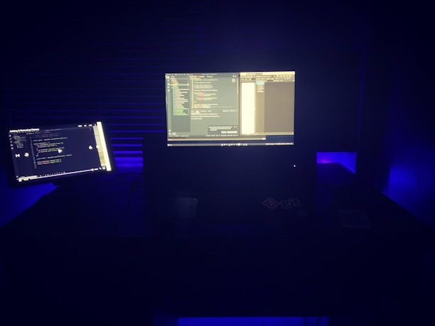 a computer monitor sitting on top of a desk