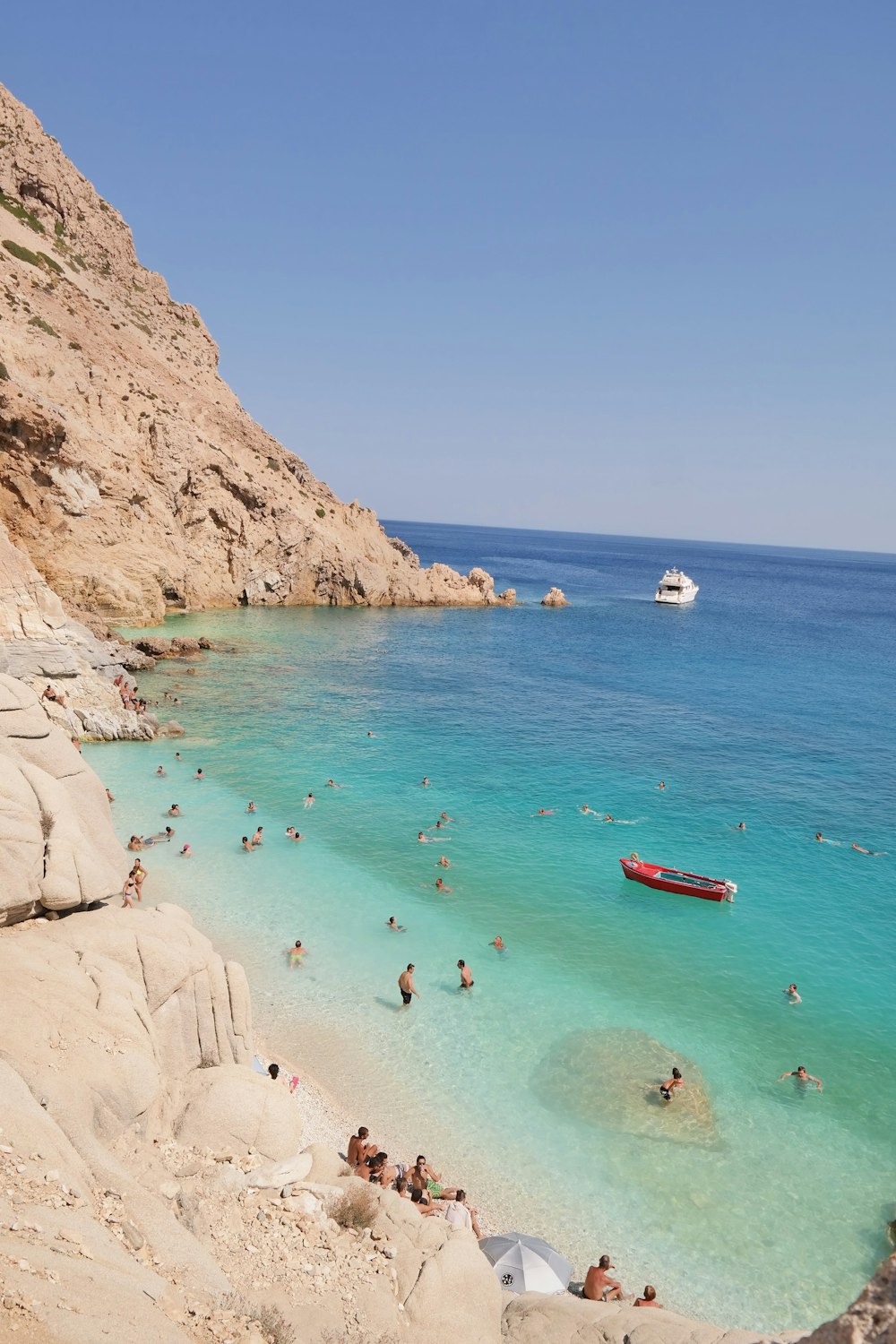 a group of people swimming in the ocean