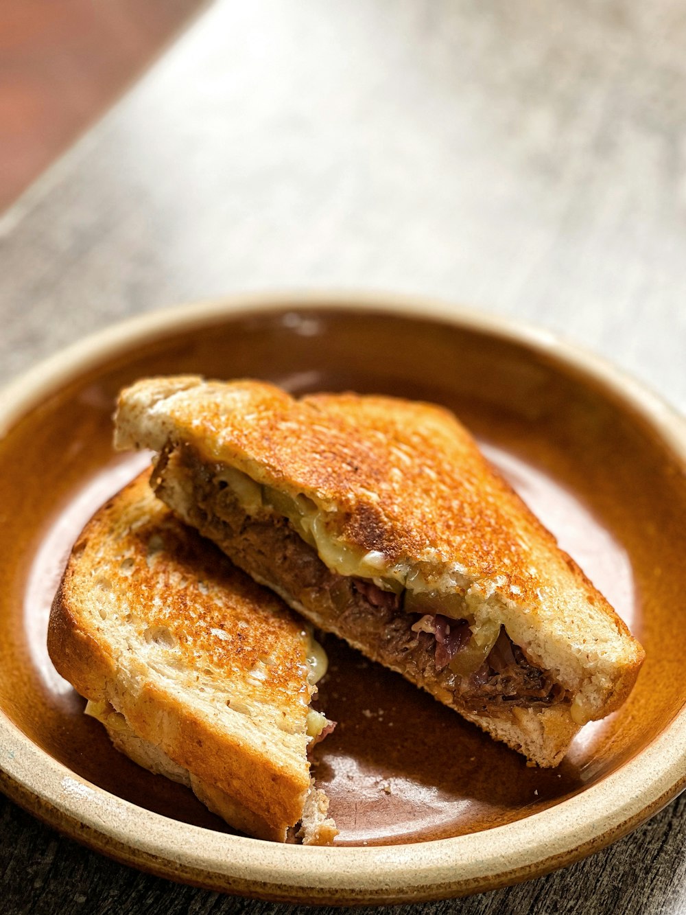 a grilled sandwich on a plate on a table