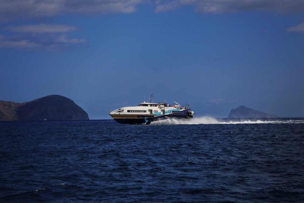 a large boat traveling across a large body of water