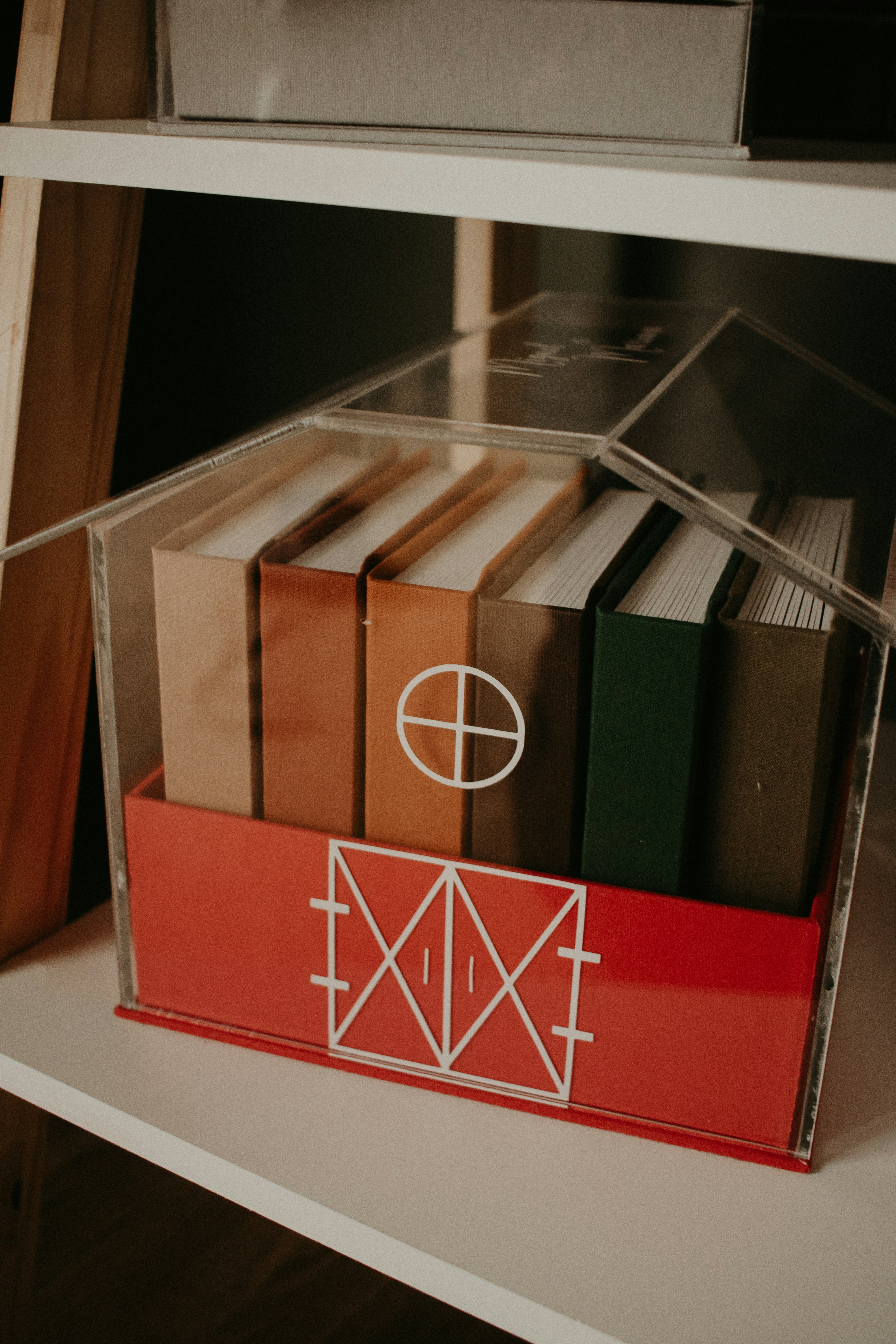 a shelf with a bunch of books on it