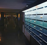a row of mail boxes sitting on the side of a building