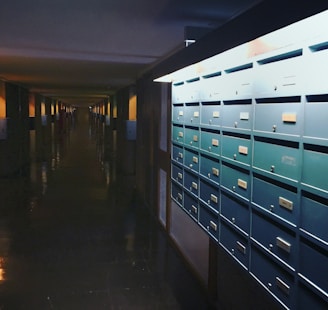 a row of mail boxes sitting on the side of a building