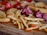 A close-up of a delicious assortment of frozen savory snacks on a wooden table.