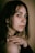 a close up of a person with a ring on her finger