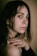 a close up of a person with a ring on her finger