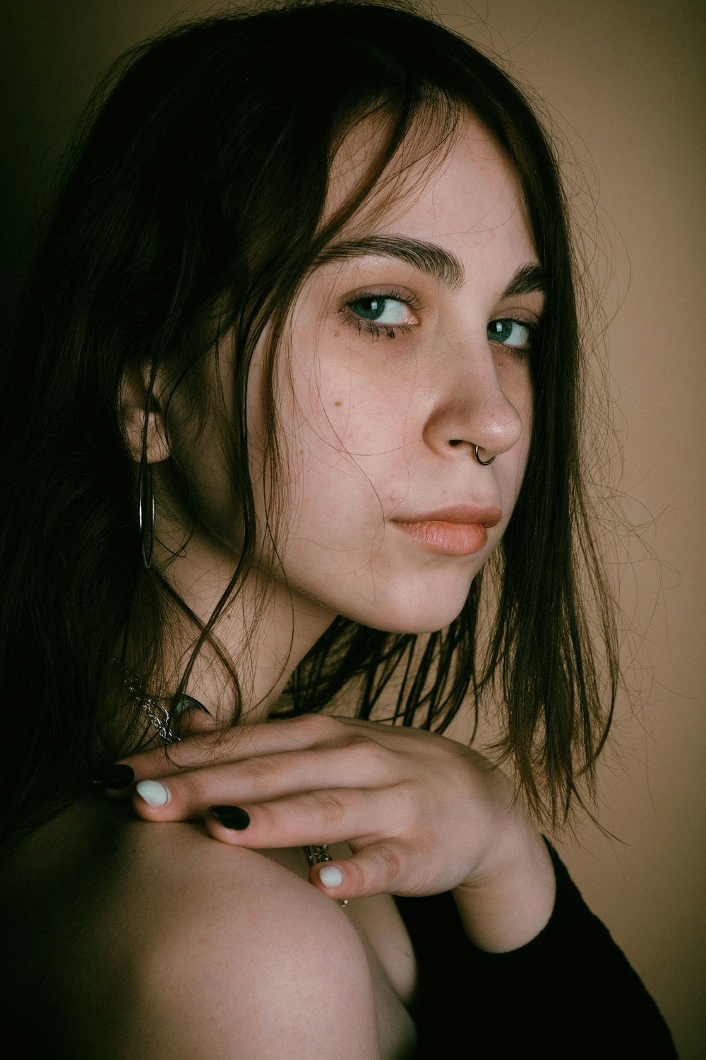 a close up of a person with a ring on her finger