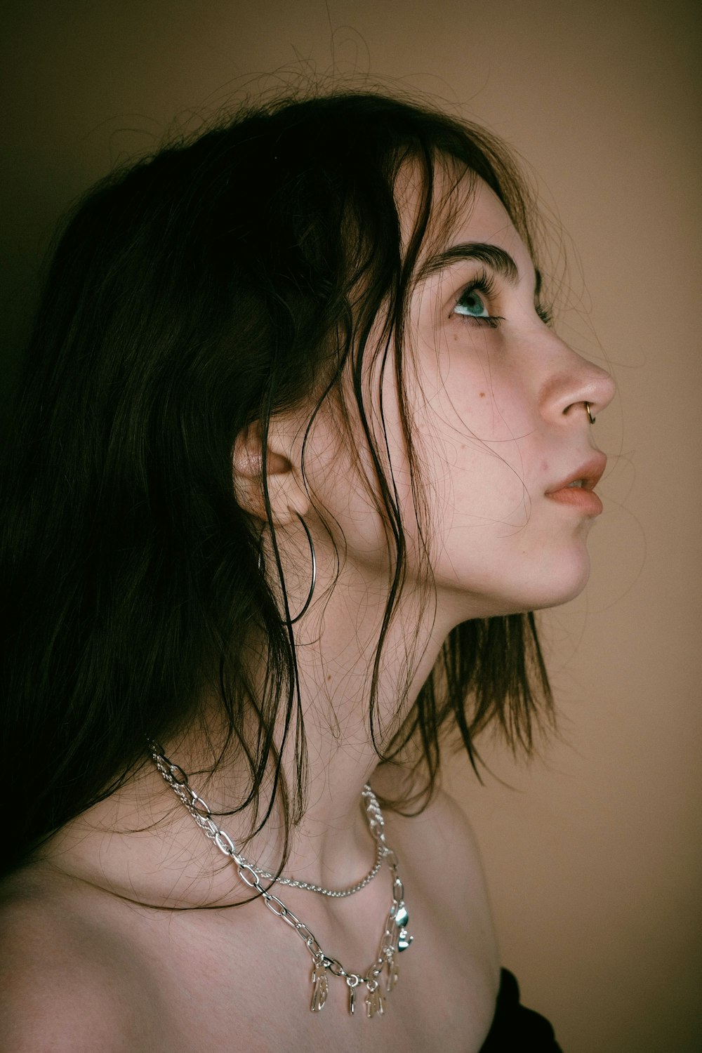 a close up of a person wearing a necklace