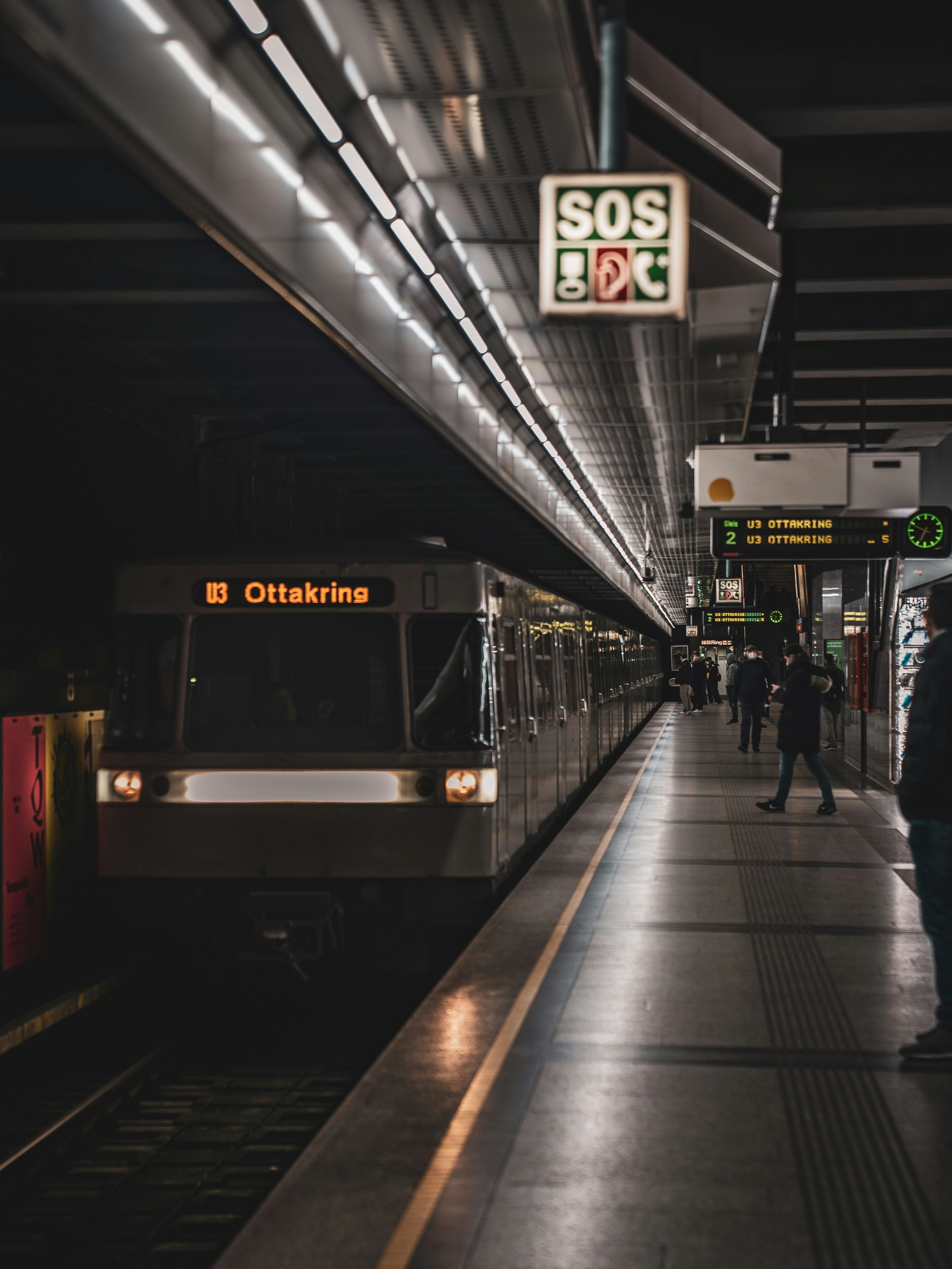 a train pulling into a train station next to a platform