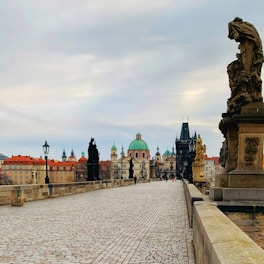 a stone bridge with a statue on top of it