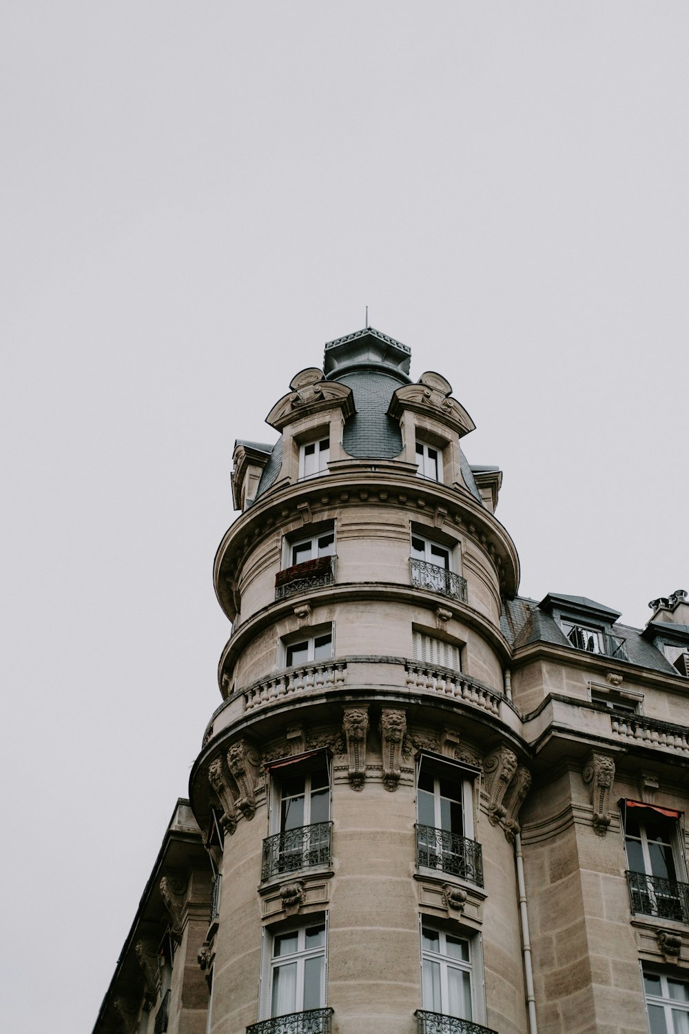 a tall building with a clock on the top of it