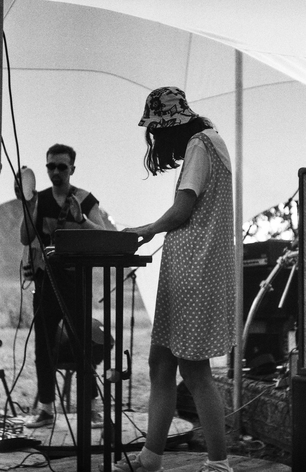 a woman standing next to a man on a stage